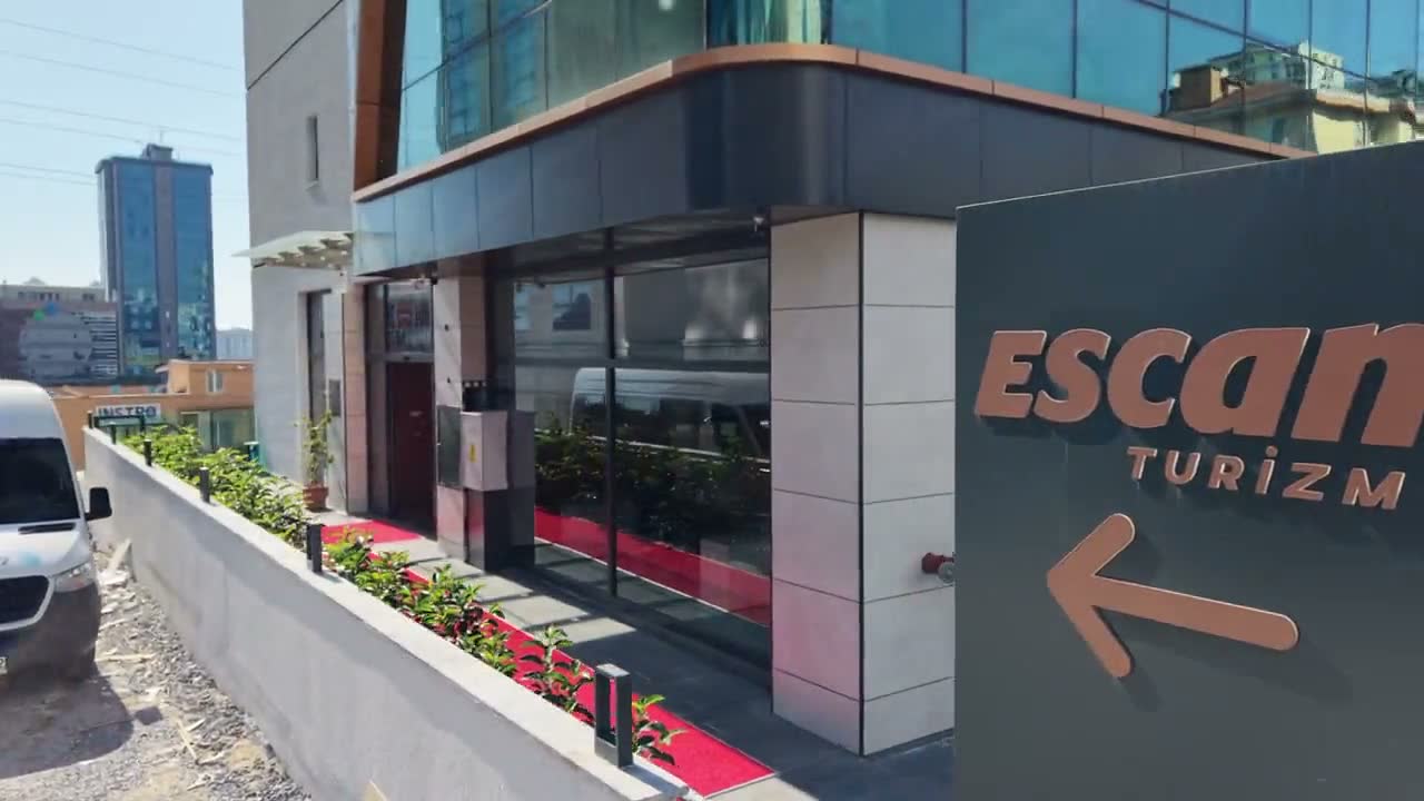 Escan Turizm bina dışı logo